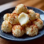Plate of cottage cheese mozzarella bites served with fresh herbs