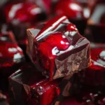 Homemade Halloween Dracula's Dark Cherry Fudge on a festive table.