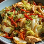 Keto Chinese Chicken Cabbage Stir-Fry with colorful vegetables in a skillet