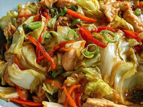 Keto Chinese Chicken Cabbage Stir-Fry with colorful vegetables in a skillet