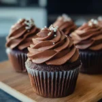 Delicious Keto Chocolate Cupcakes topped with rich chocolate frosting