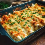 Delicious low carb white chicken enchiladas topped with cheese and green onions