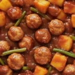 Slow Cooker BBQ Pineapple Meatballs served on a platter with pineapple chunks