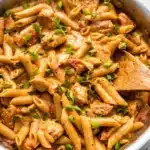 One-Pot Creamy Spicy Cajun Sausage Pasta with cheese and spices