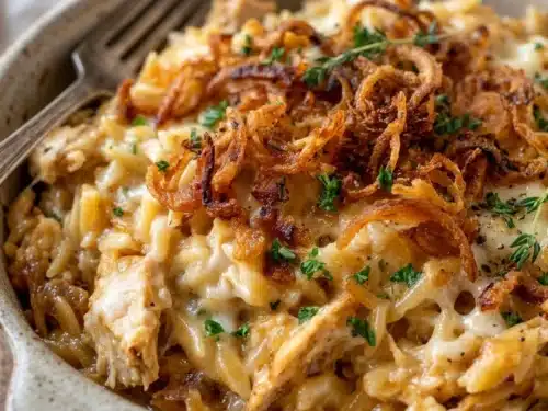Delicious French Onion Chicken Orzo Casserole garnished with herbs