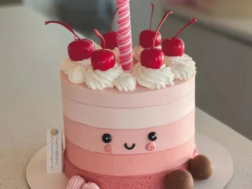 Colorful birthday cake with cherries, perfect for a girl's party.
