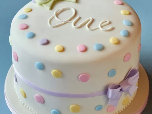 Colorful decorations and cake for a child's first birthday celebration at crimsoncake