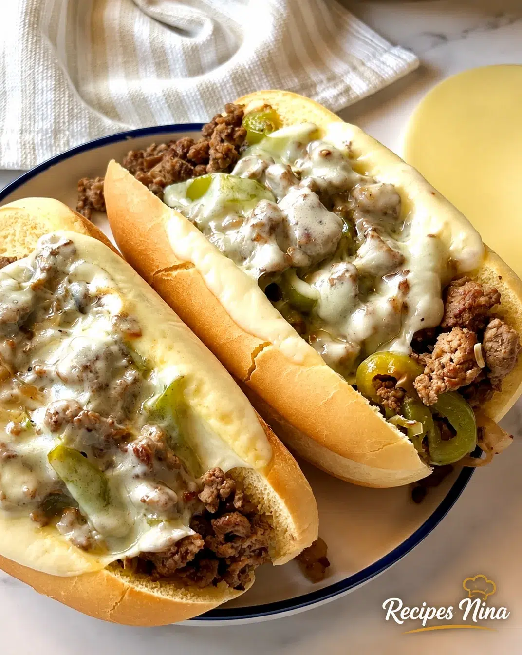 Quick and easy Ground Beef Philly Cheesesteak served with toppings
