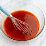 A bowl of homemade hot honey sauce made with three ingredients.