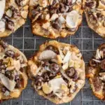 Delicious 4-ingredient Almond Joy Cookies with chocolate and coconut topping