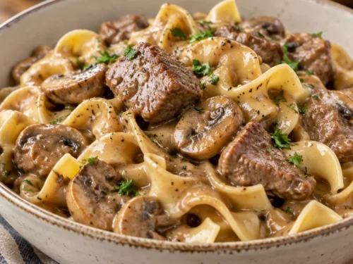 Simple Beef Stroganoff served in a bowl with noodles and mushrooms